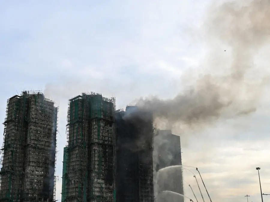 Hong Kong high-rise fire continues to burn; death toll rises to 55, hundreds still unaccounted for