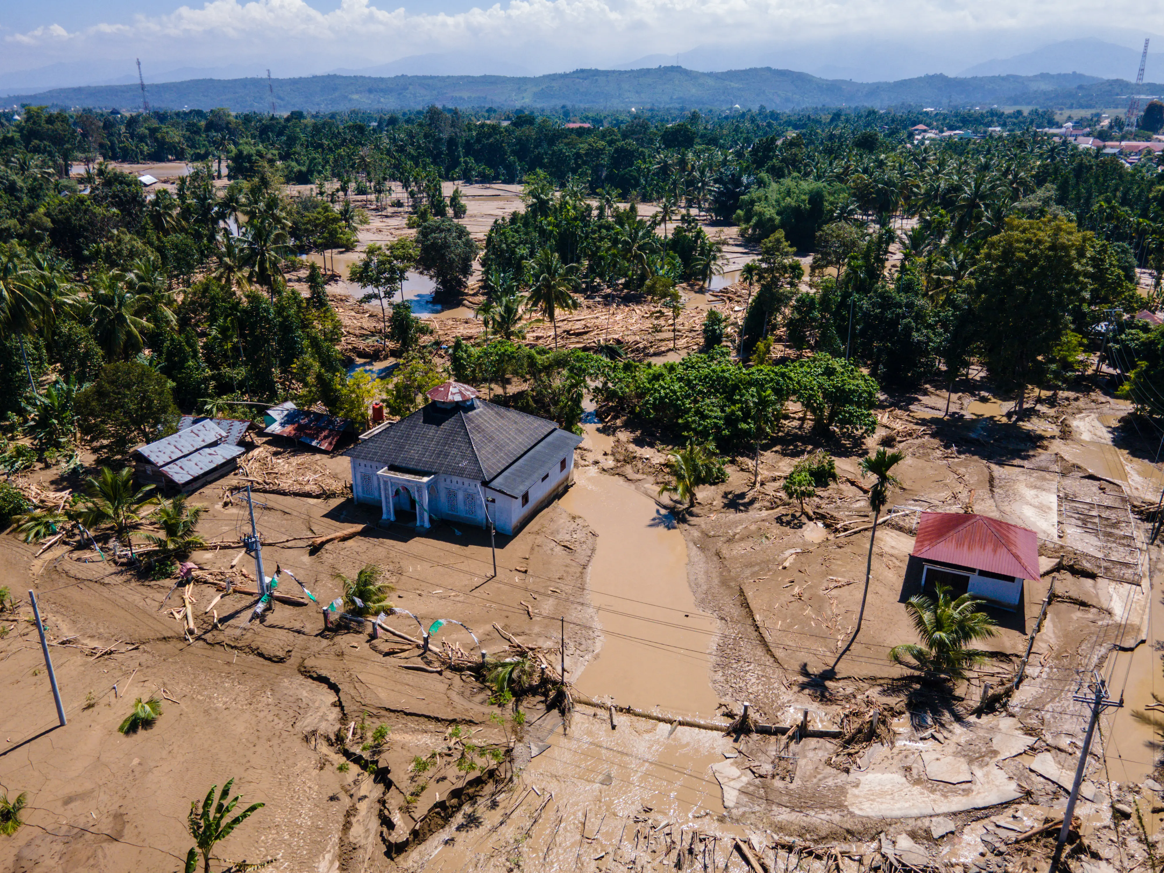 Indonesia reels after floods ravage island, killing hundreds