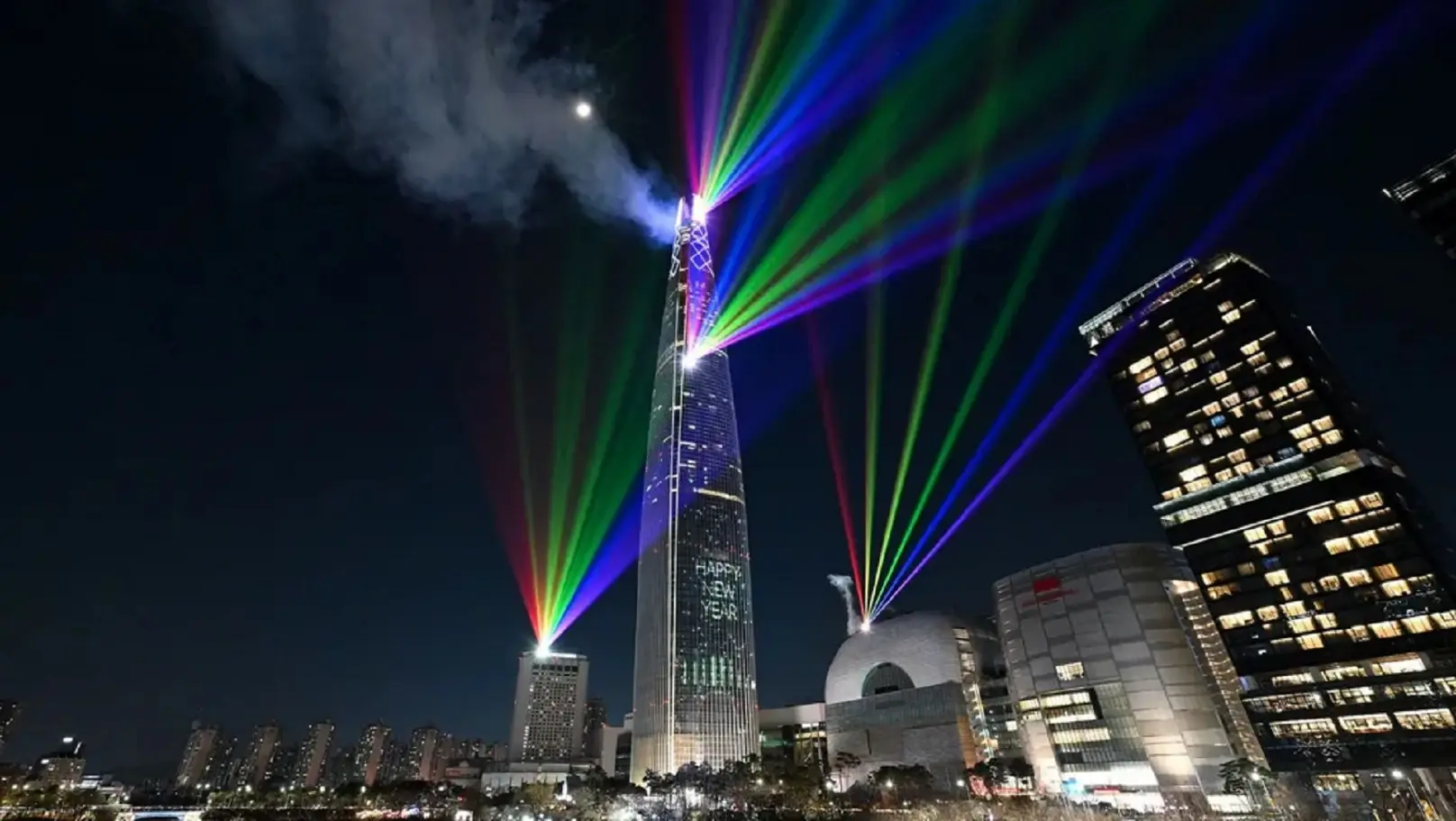 Laser lights illuminate the night sky over the Lotte World Tower in Seoul