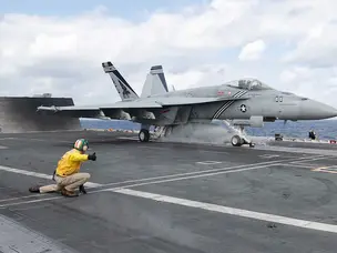 How do F/A-18 Super Hornets maintain USS Abraham Lincoln’s combat edge?