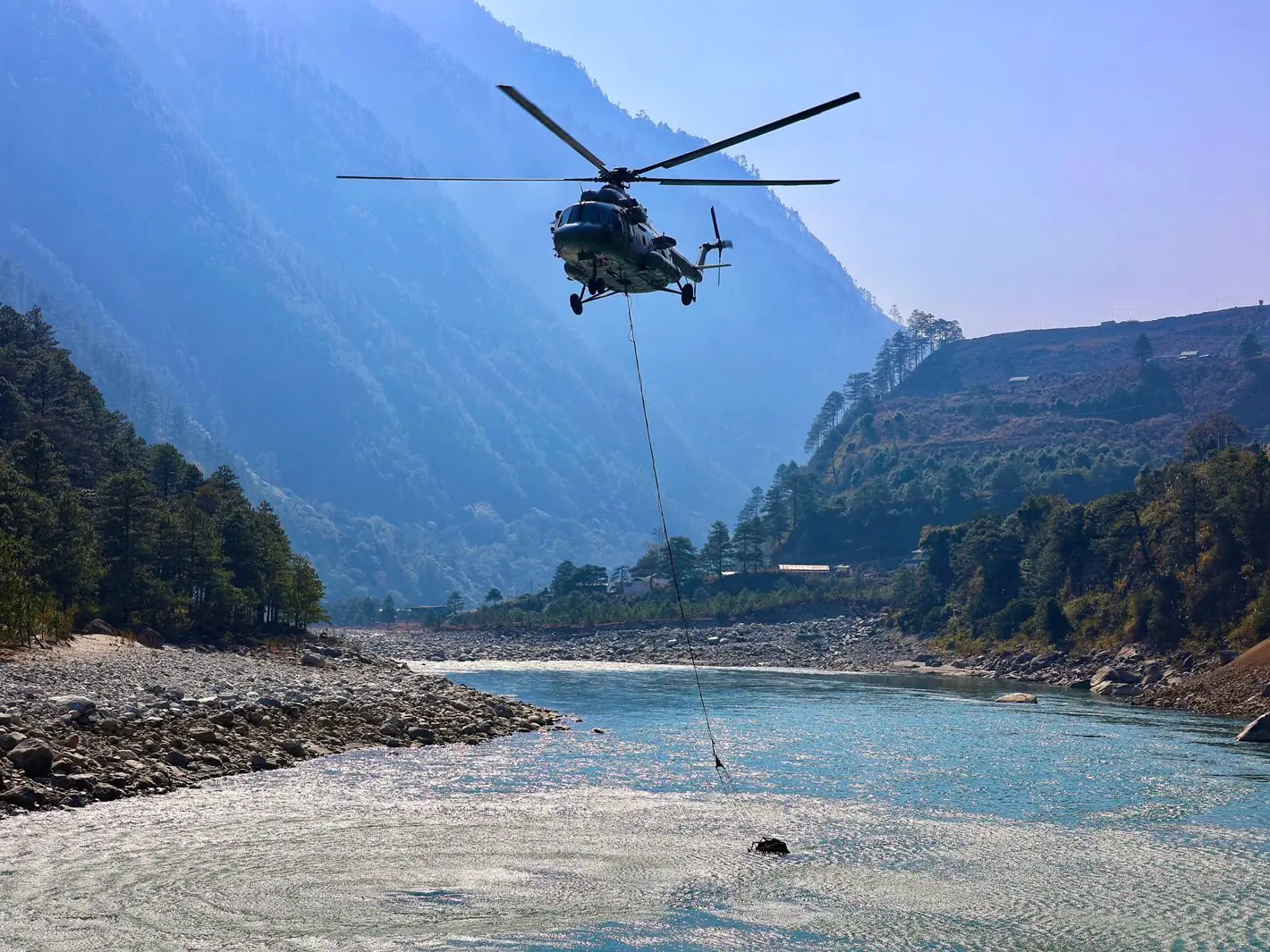 Indian Air Force's Mi-17V5 helicopters dropped 12,000 litres of water in the rarefied Himalayan air Indian Air Force's Mi-17V5 helicopters dropped 12,000 litres of water in the rarefied Himalayan air