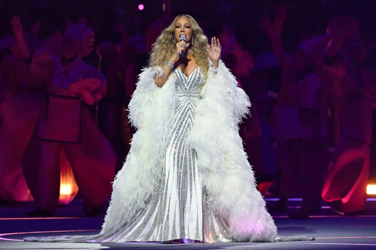 Reading off a teleprompter? Mariah Carey accused of lip-syncing during her performance at Winter Olympics