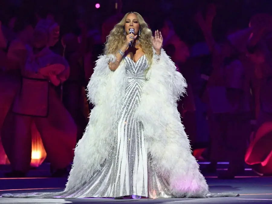 Reading off a teleprompter? Mariah Carey accused of lip-syncing during her performance at Winter Olympics