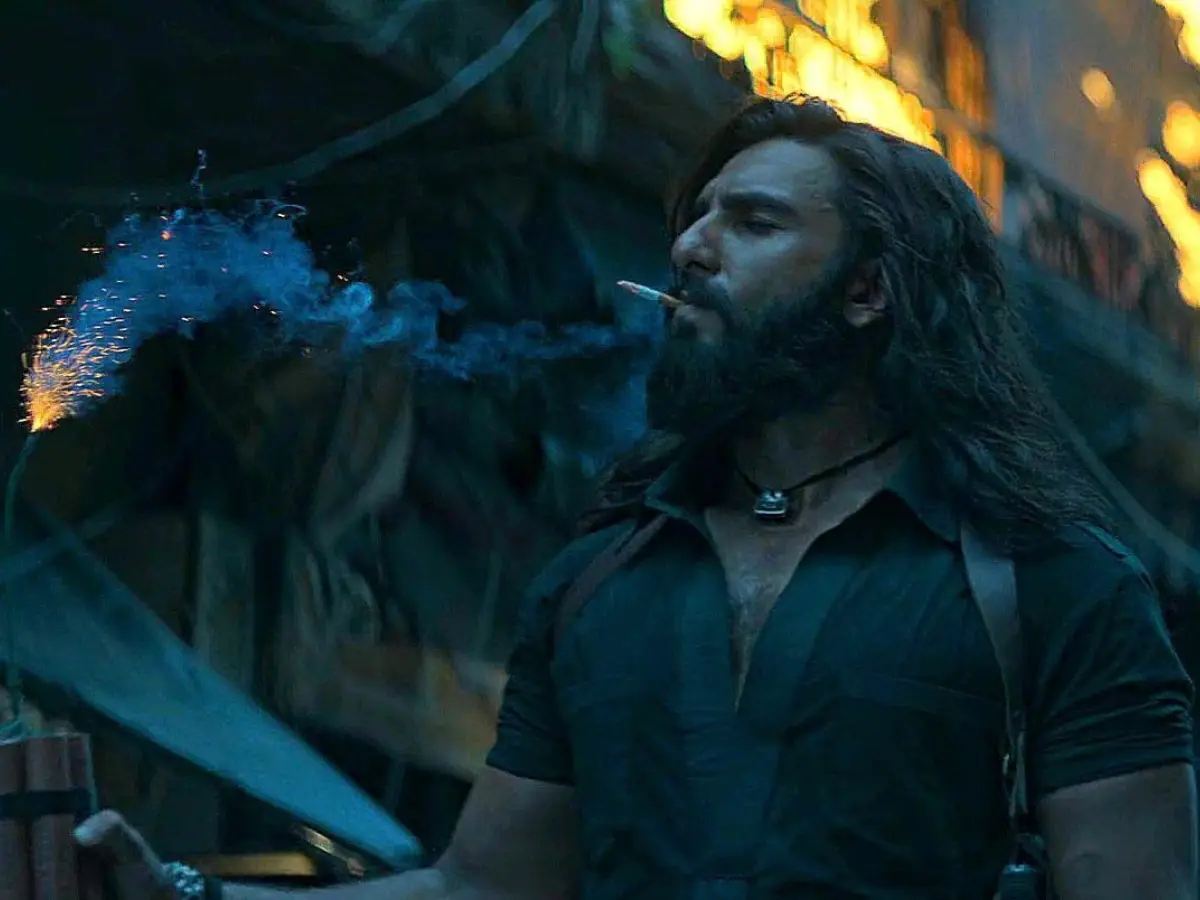 Lights a bomb with his cigarette
