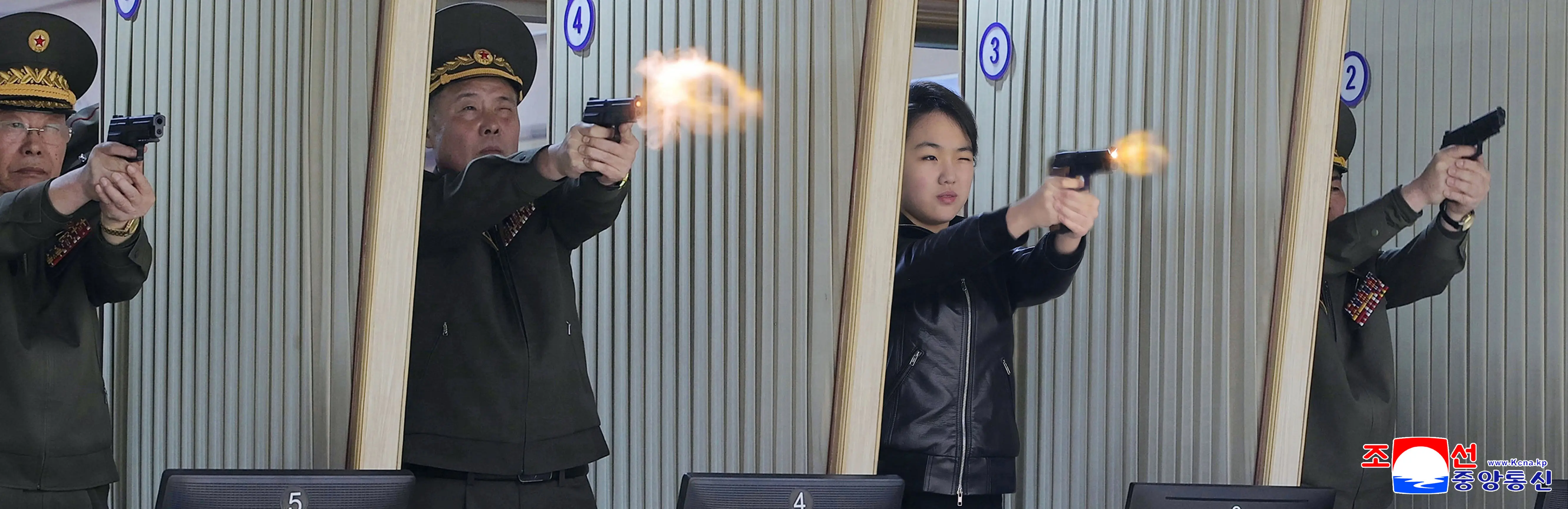 Ju Ae fires pistol at weapons facility