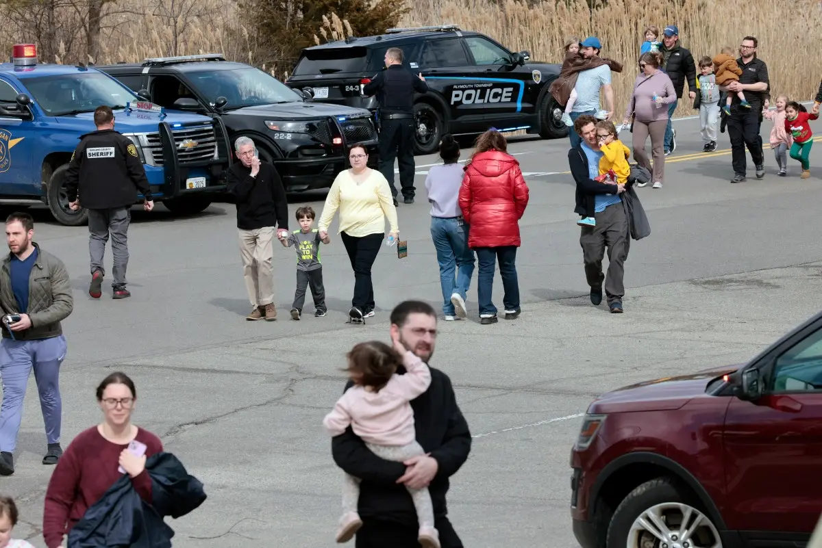 Security officers confront armed suspect