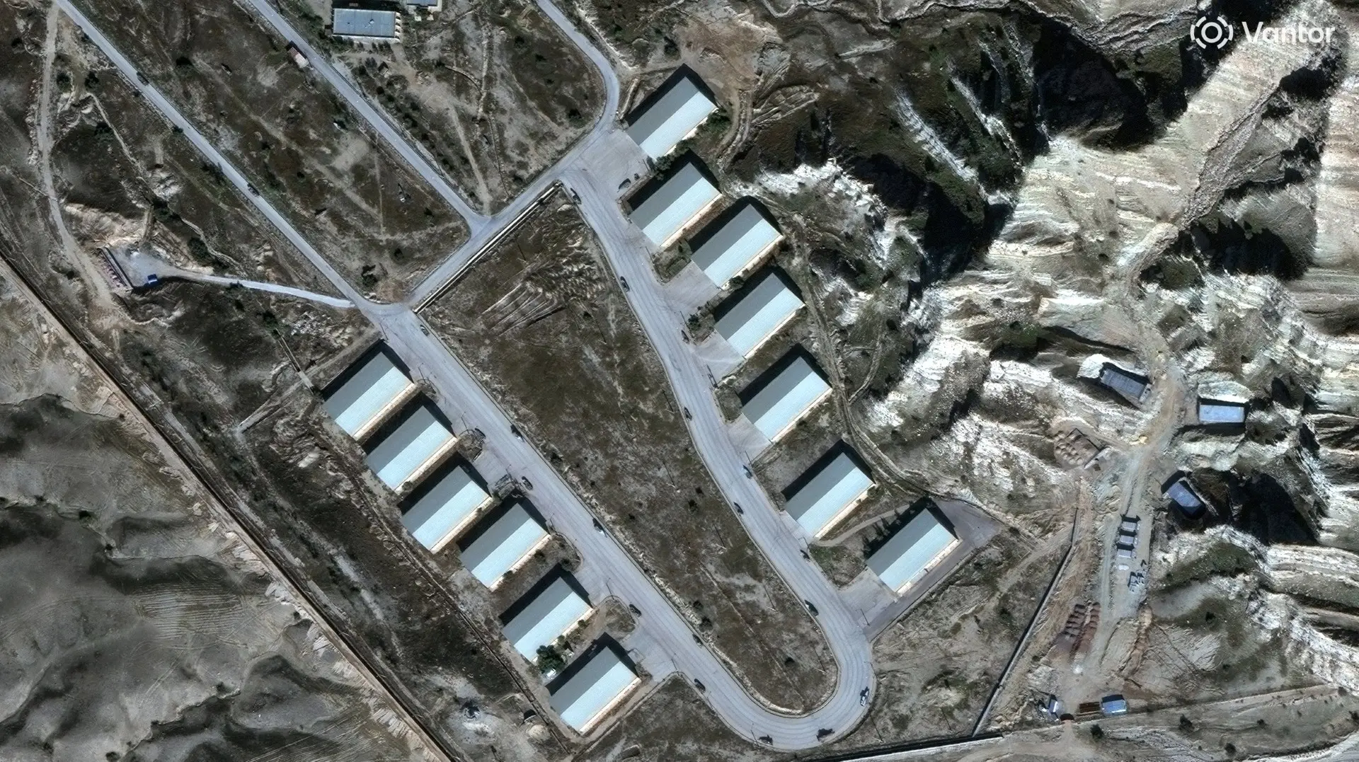 Satellite images show trucks removing rubble