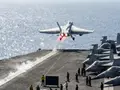Do fighter jets use afterburner during takeoff from USS Abraham Lincoln?