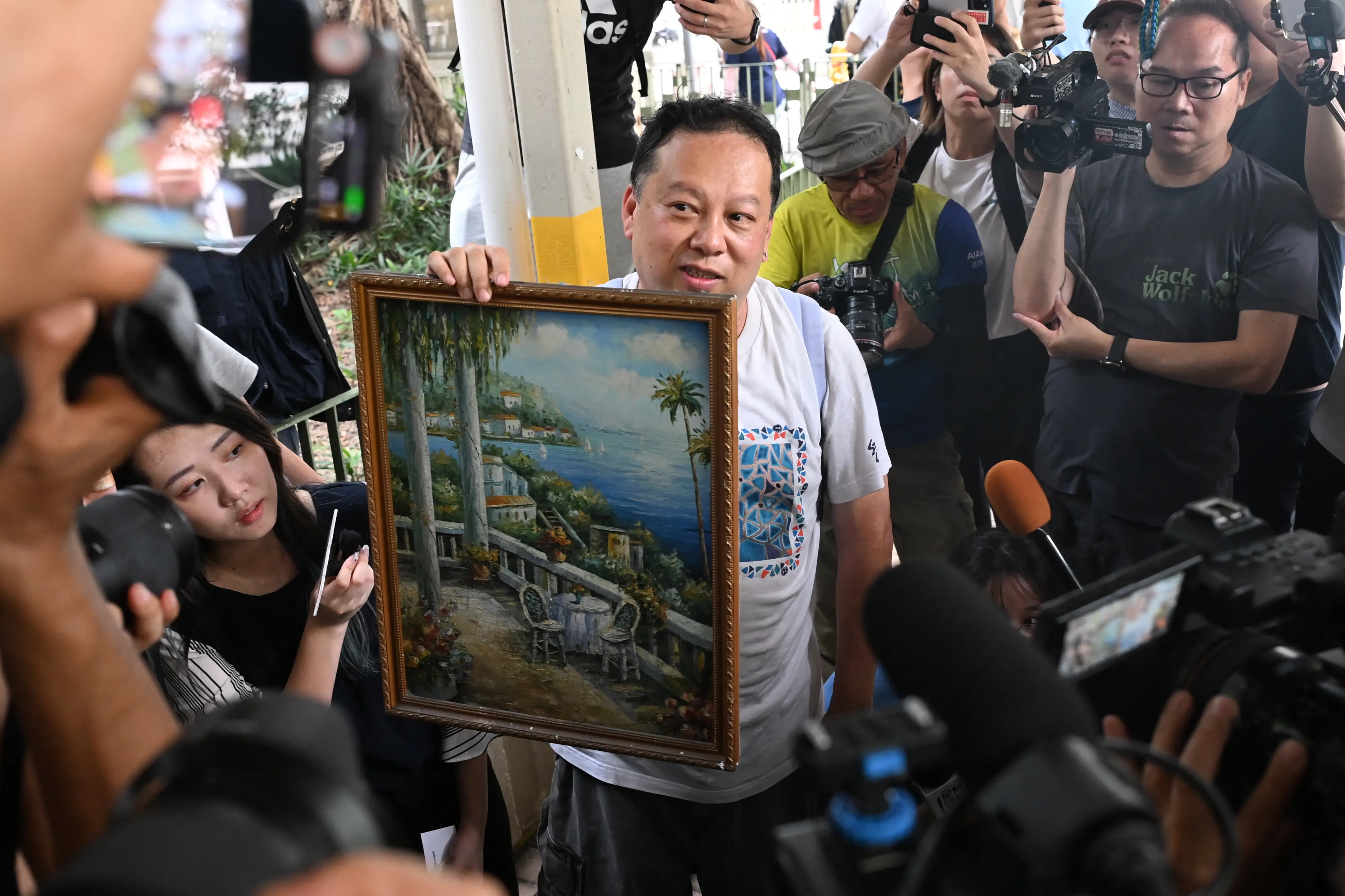 Victims leave building with remnant belongings