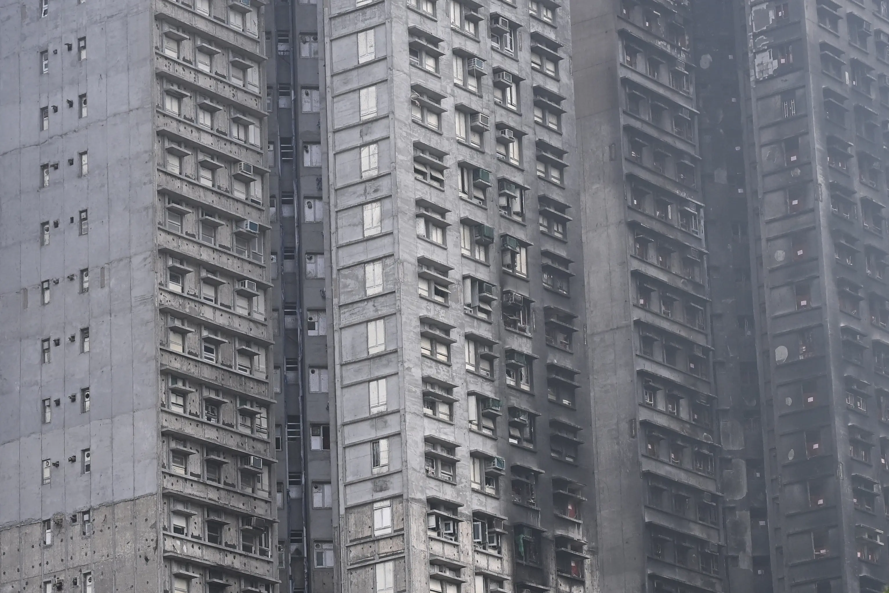 Seven towers gutted in deadly fire