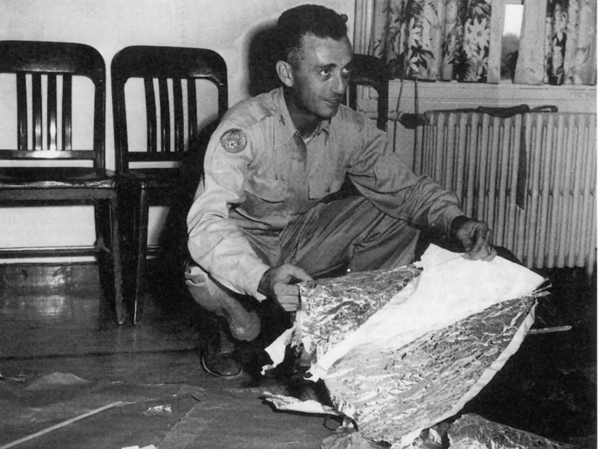 An official holding debris from the Roswell incident