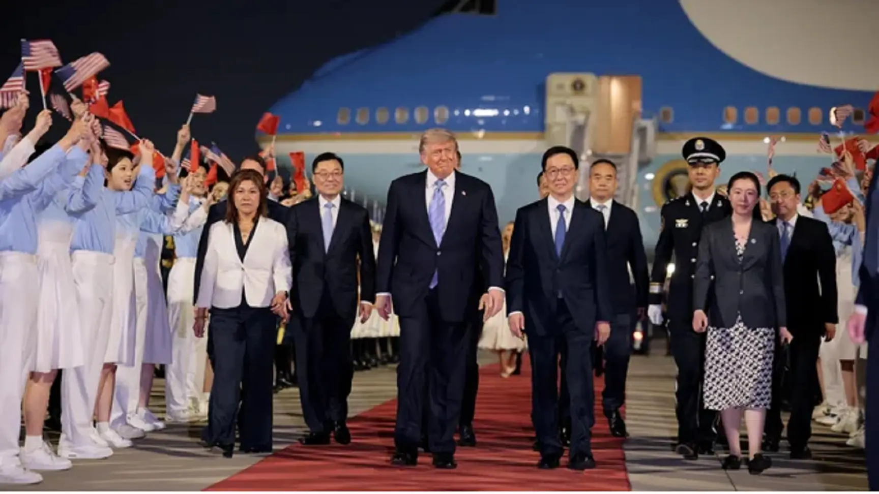 Trump lands in China for summit with Xi, welcomed with red carpet and fanfare