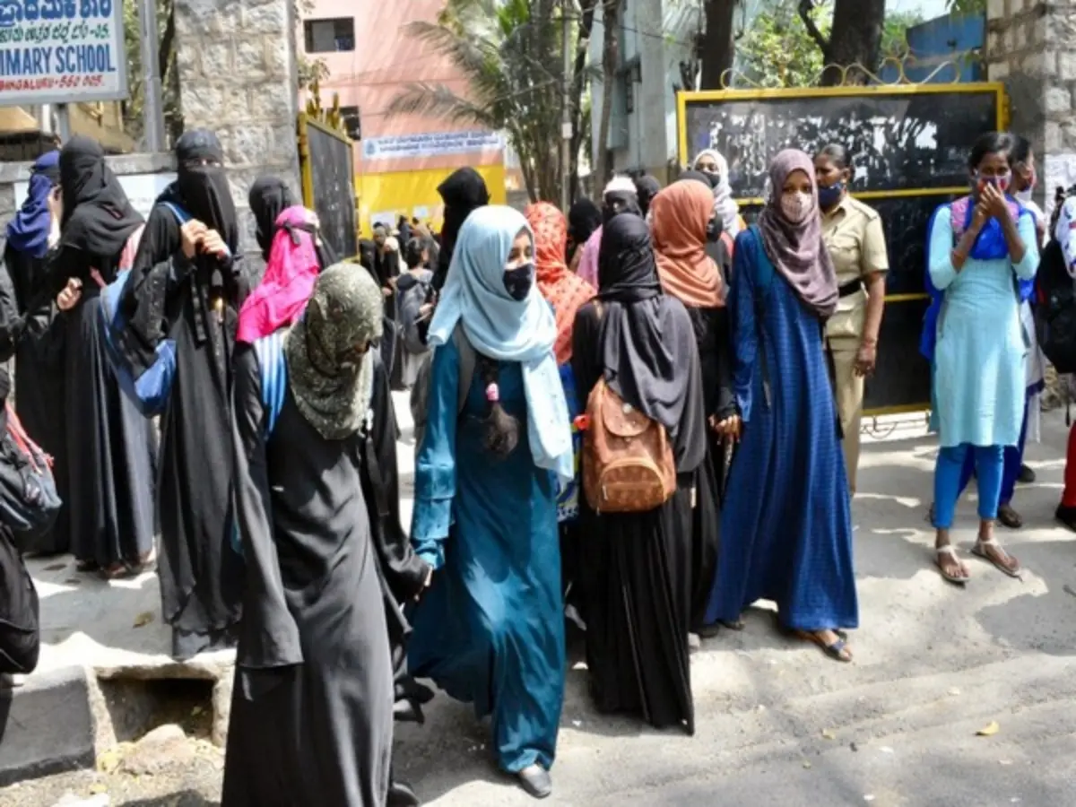 Law banning hijab, wearing of religion-based symbols in educational institutions revoked in Karnataka Law banning hijab, wearing of religion-based symbols in educational institutions revoked in Karnataka