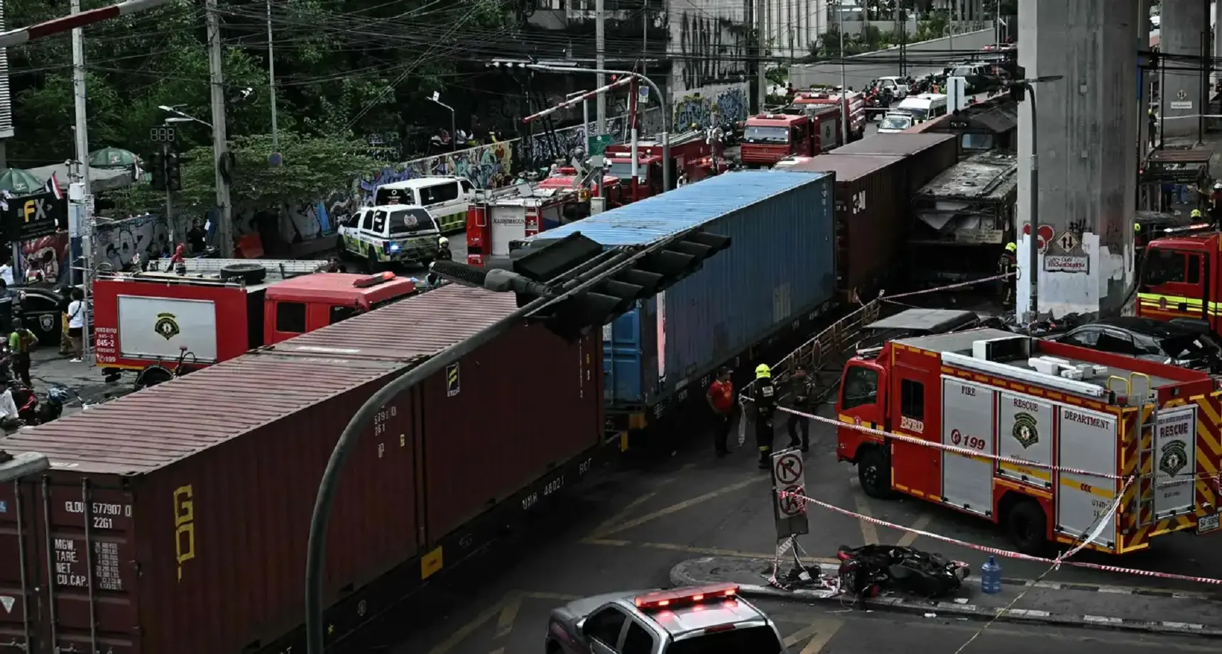 Eight killed, 32 injured as freight train hits bus at rail crossing in Bangkok