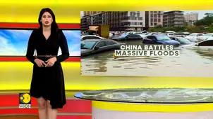 China Floods: Residents Wade Through Waterlogged Streets 