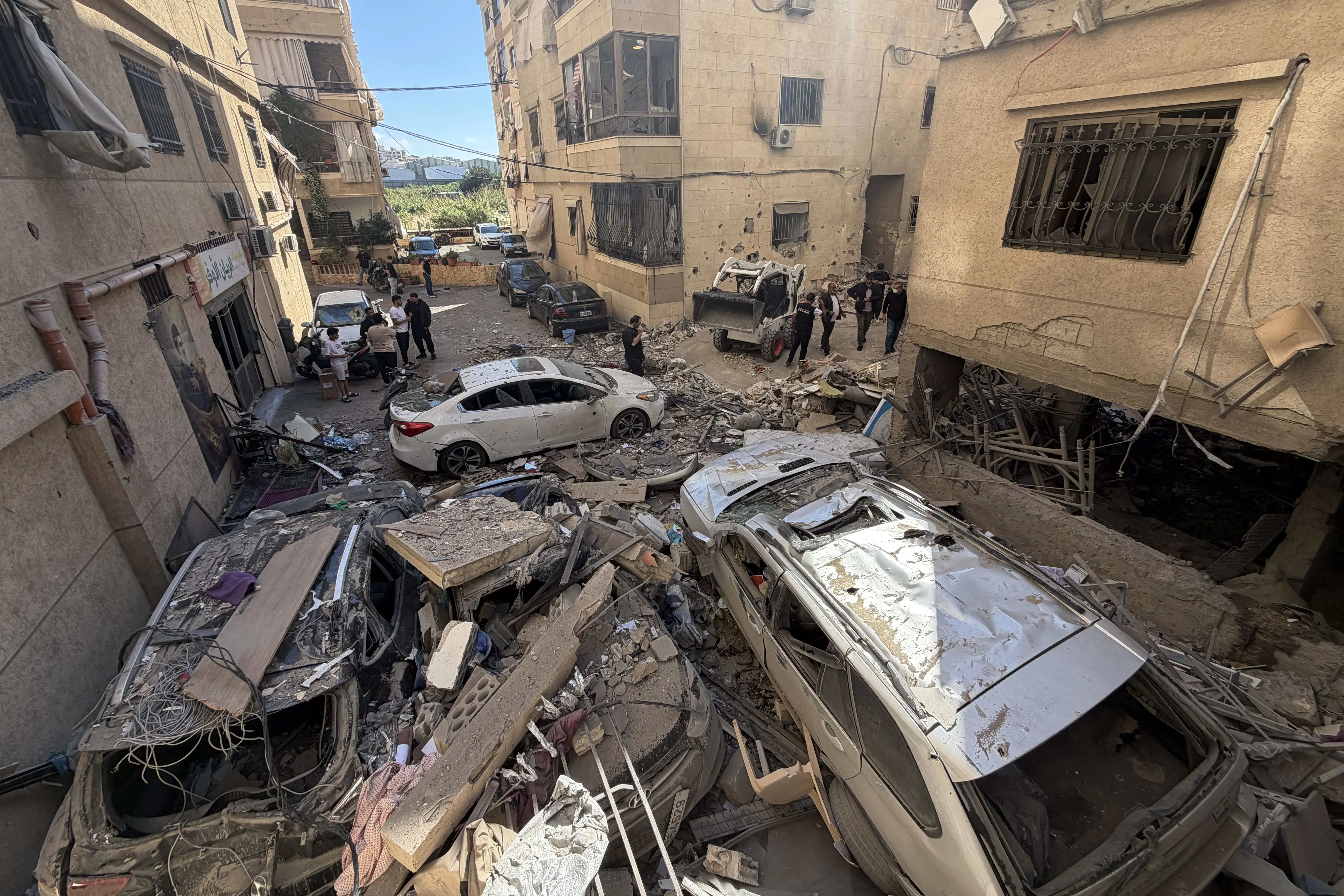Israel launches wave of deadly strikes near Beirut, kills woman and two children amid truce violations