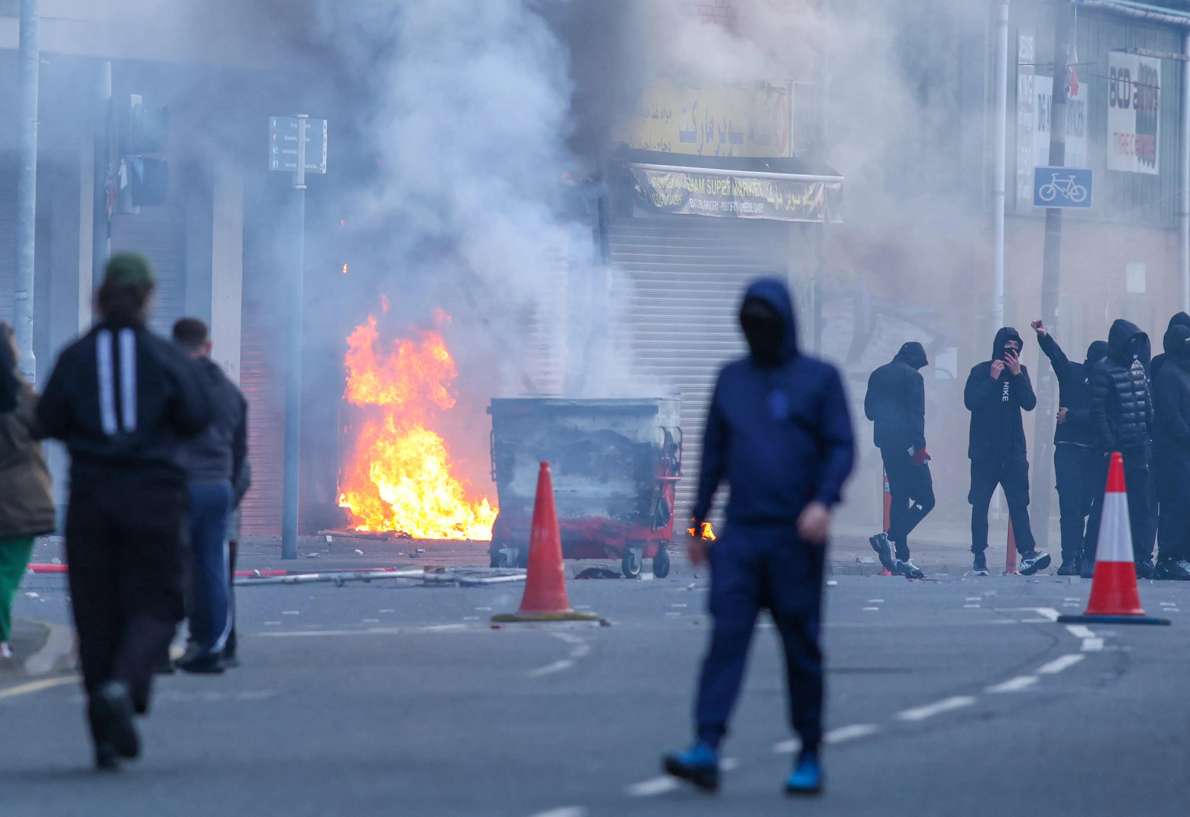 Belfast unrest: Bus torched, roads blocked as protests erupt across Northern Ireland after knife attack