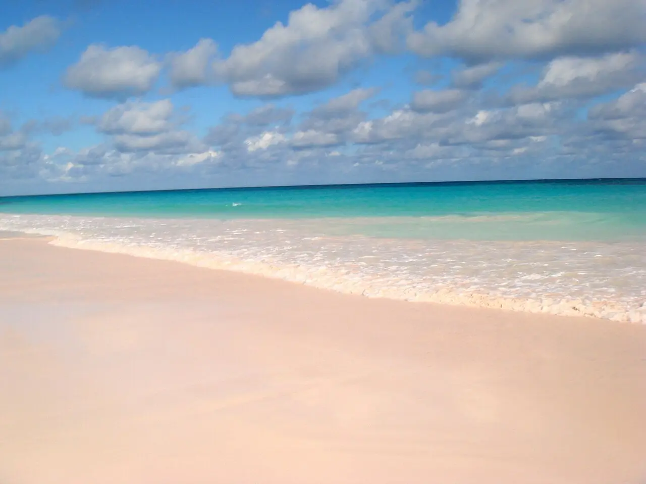 Why is this beach filled with pink sand? Why is this beach filled with pink sand?