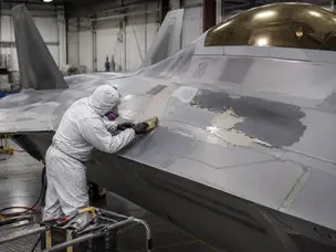 Why is the paint on the F-22 so difficult and expensive to maintain?