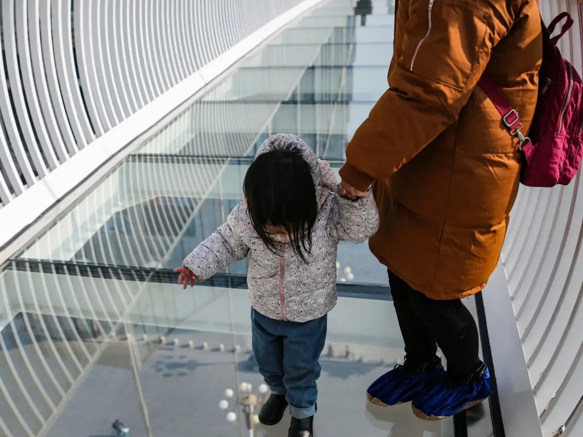 Glass bridge in China cracks after being poked with an umbrella, official says it is safe Glass bridge in China cracks after being poked with an umbrella, official says it is safe