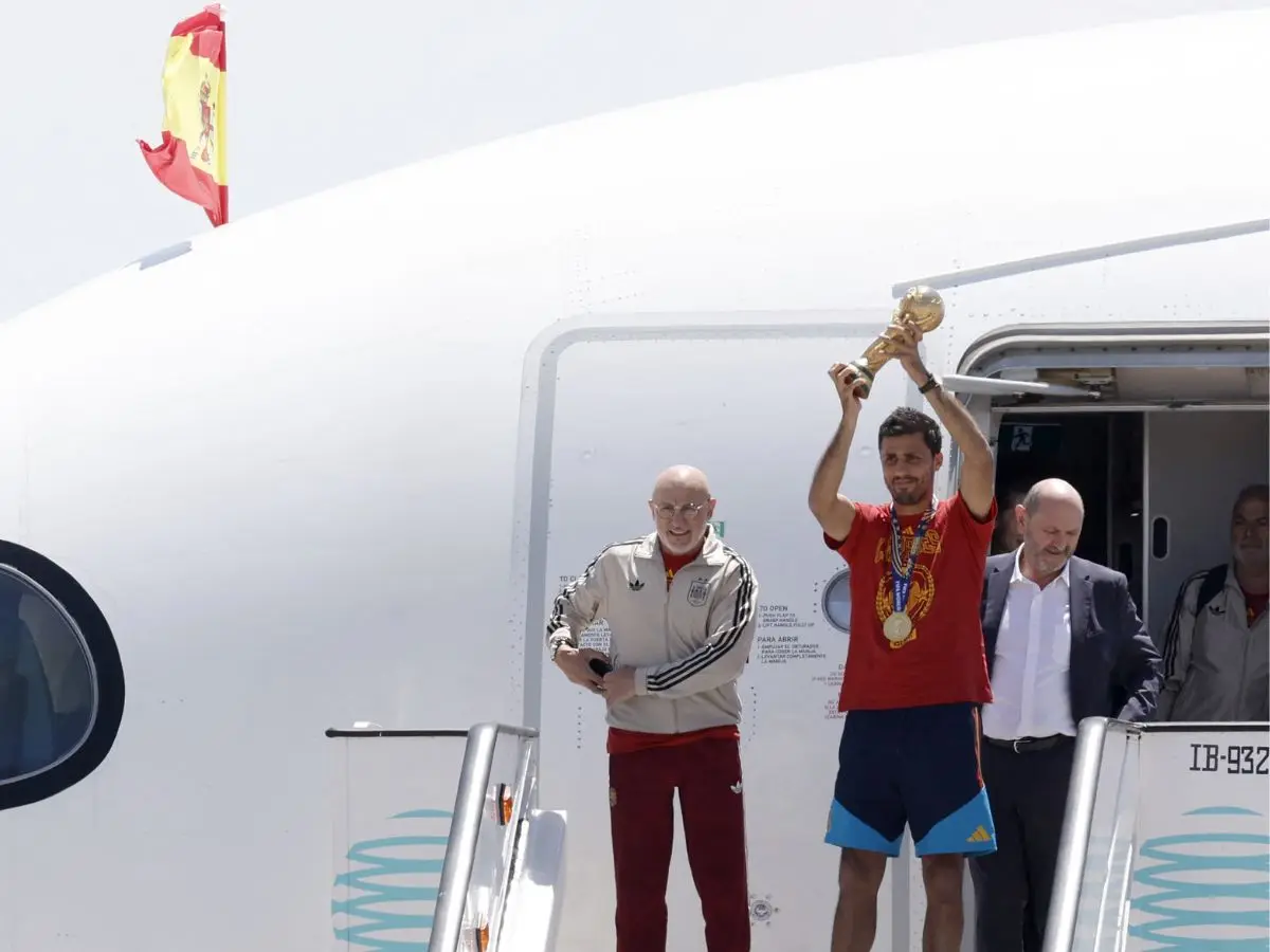 Rodri lifts trophy upon landing as world champions Spain touch down in Madrid