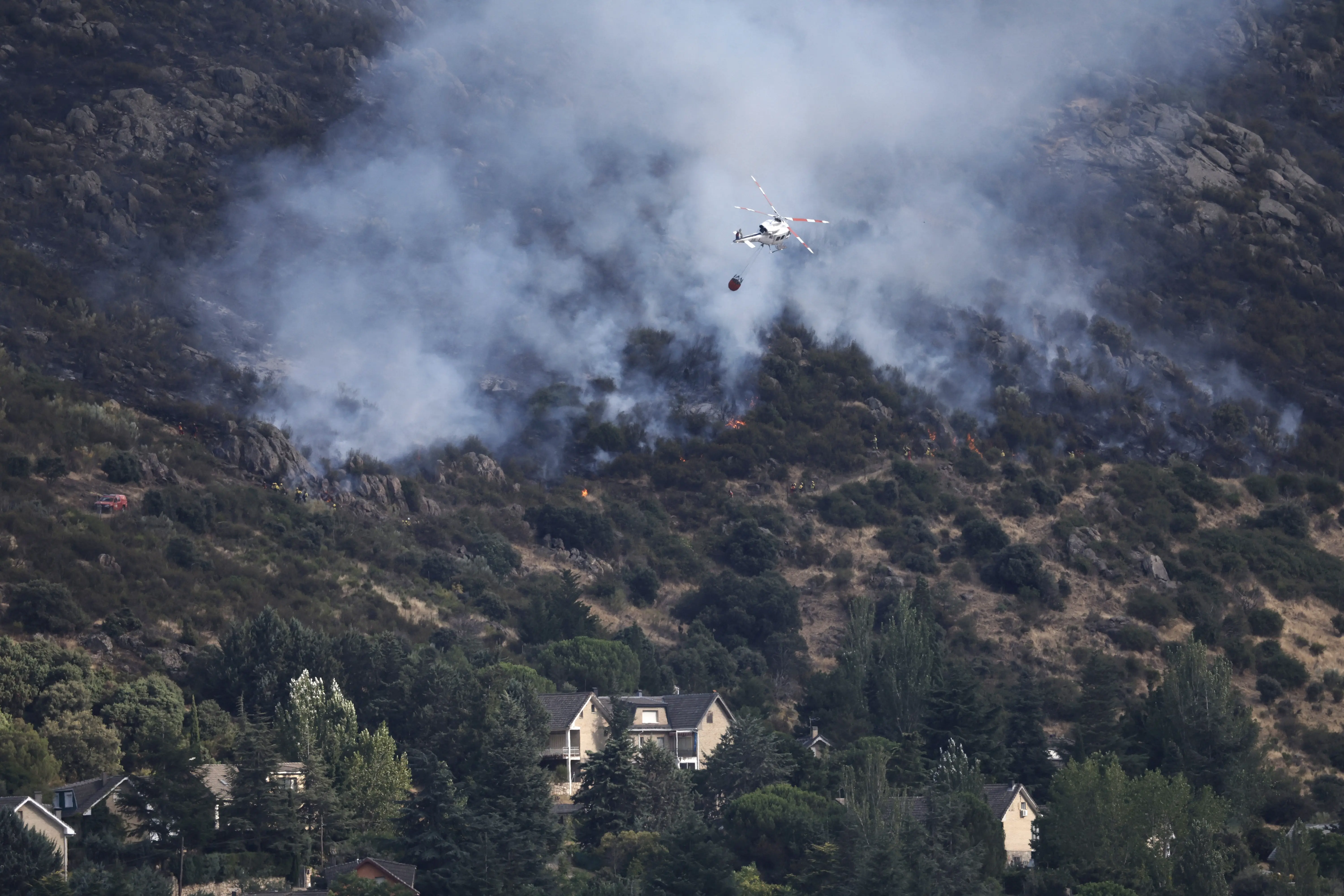 France, Spain wildfires force 267,000 to flee; Macron says, 'We will rebuild'