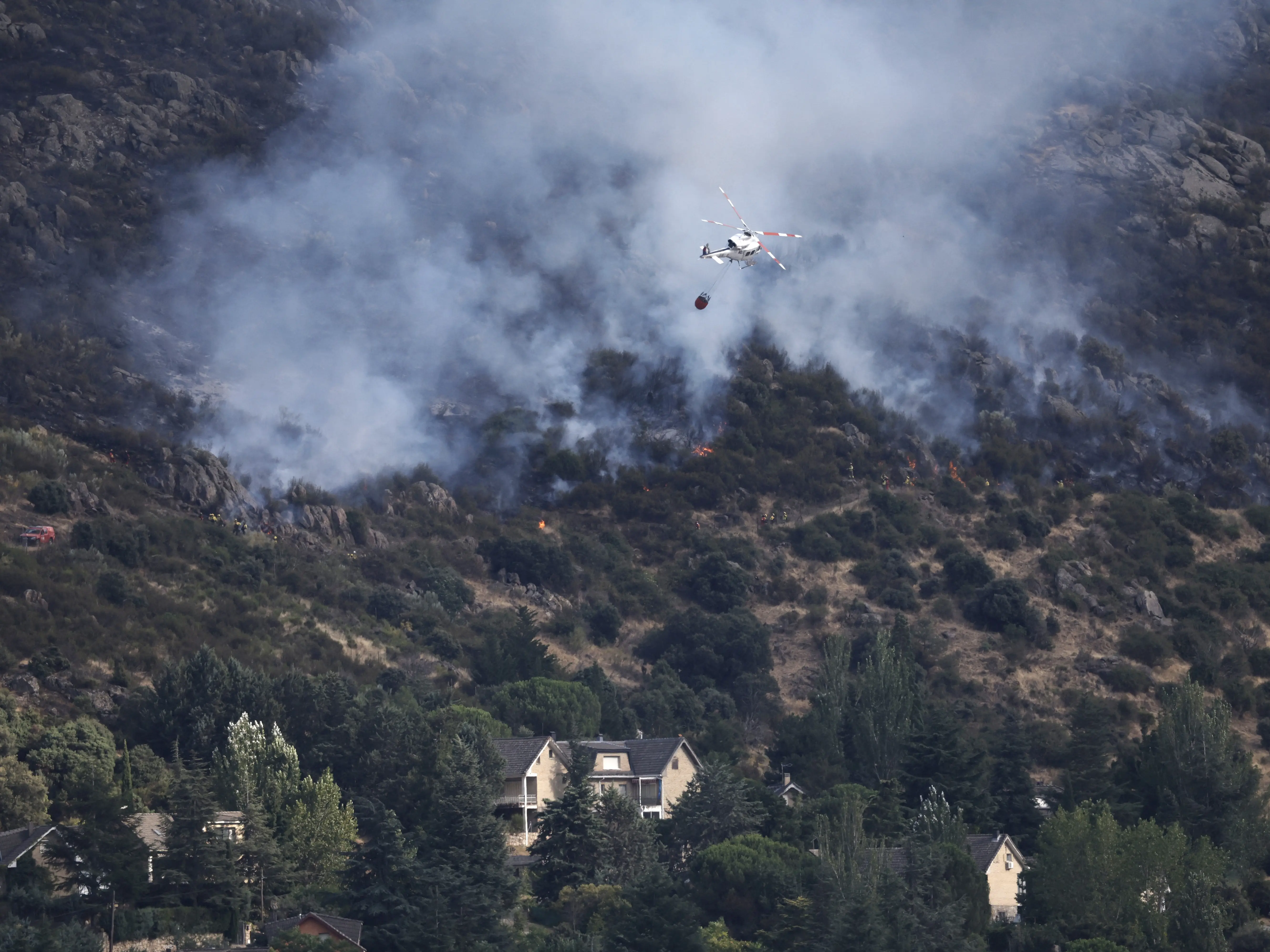 France, Spain wildfires force 267,000 to flee; Macron says, 'We will rebuild'