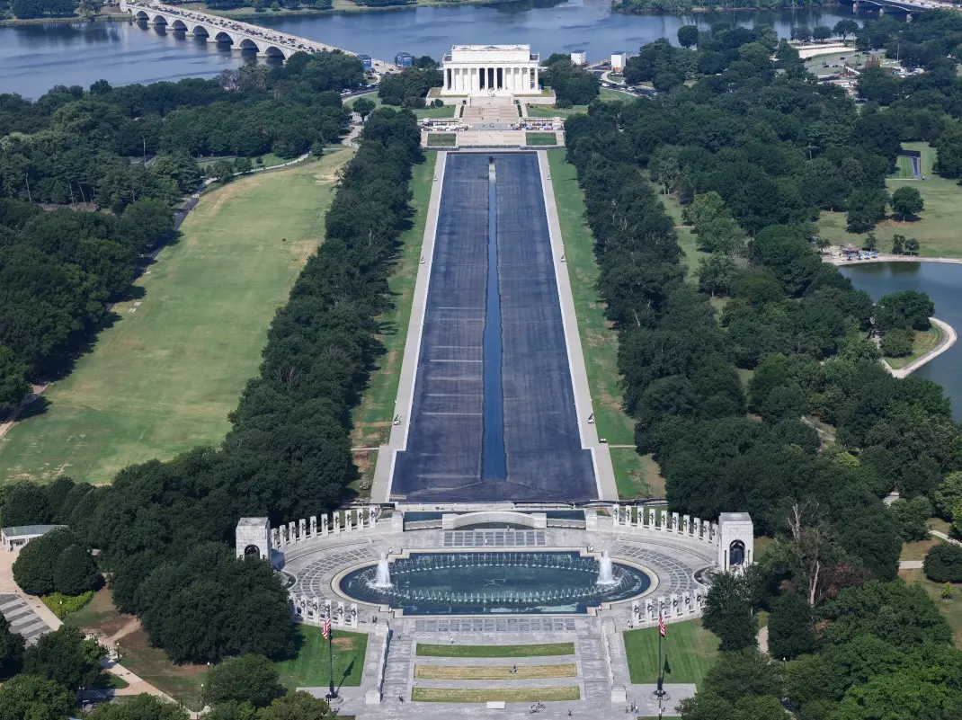 Trump administration drops Olympian's Reflecting Pool case, blames damage on botched installation Trump administration drops Olympian's Reflecting Pool case, blames damage on botched installation