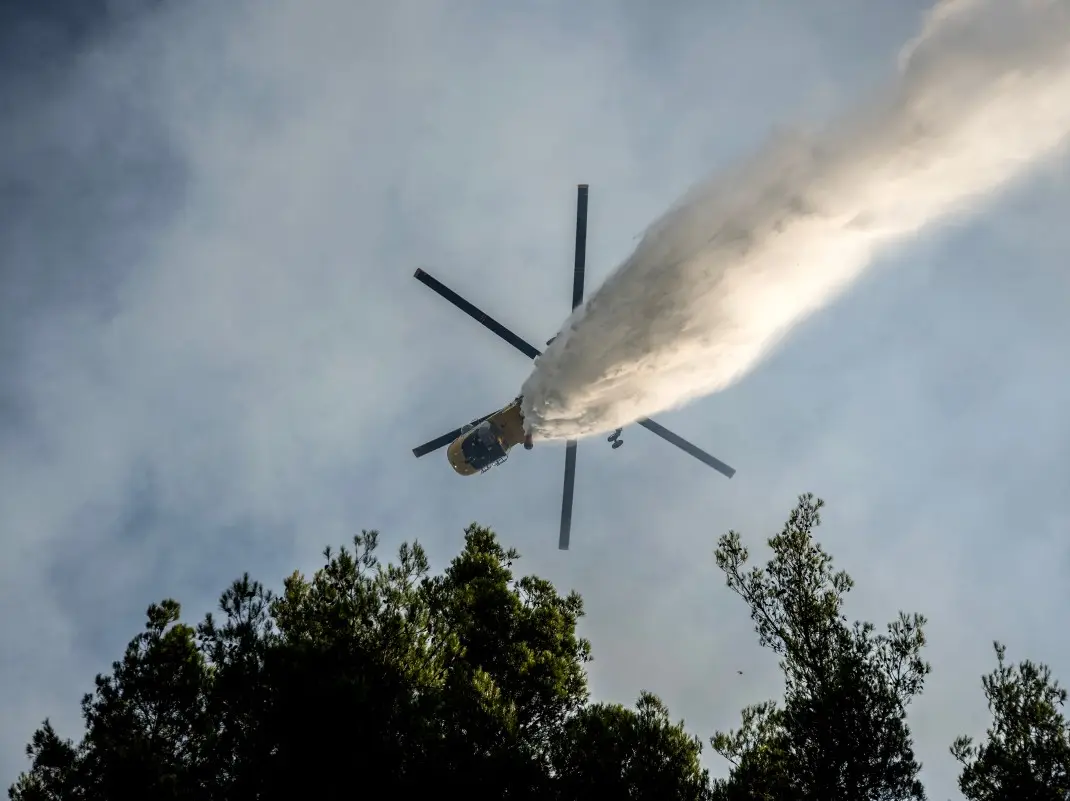 Two dead as firefighting helicopters collide midair while battling massive Greece wildfire near Athens Two dead as firefighting helicopters collide midair while battling massive Greece wildfire near Athens