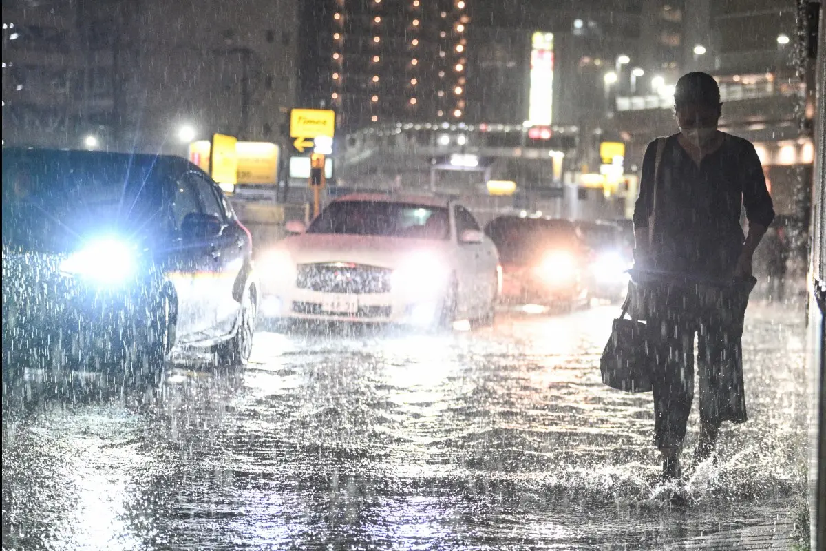 Record rainfall batters eastern Japan, killing eight and stranding thousands at Narita airport