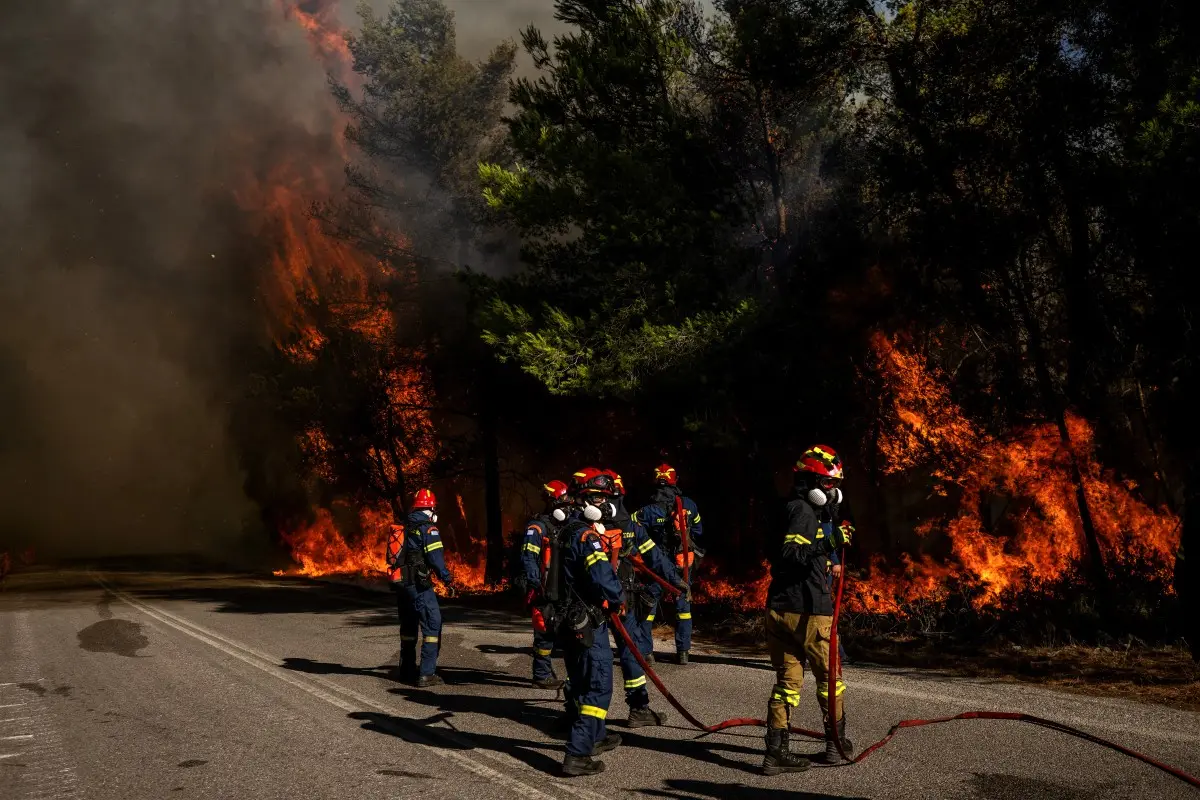 Wildfires rage across Greece and Croatia as tourists flee; firefighters battle flames and smoke
