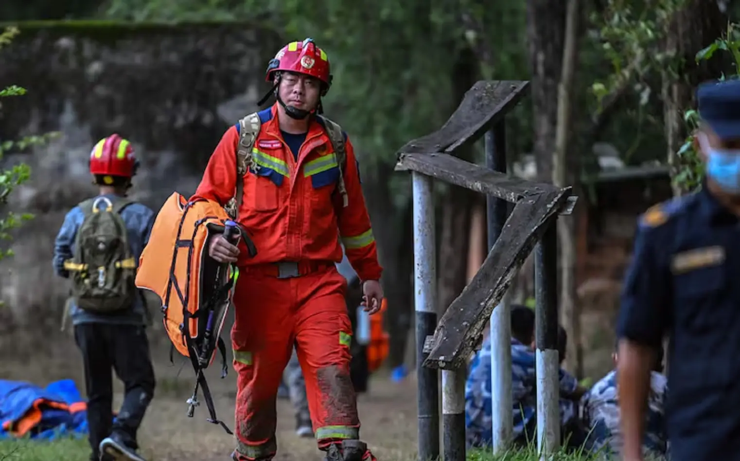 Rescuers blast hillside in search of over 900 missing hydropower workers; Nepal flood toll surges to 939