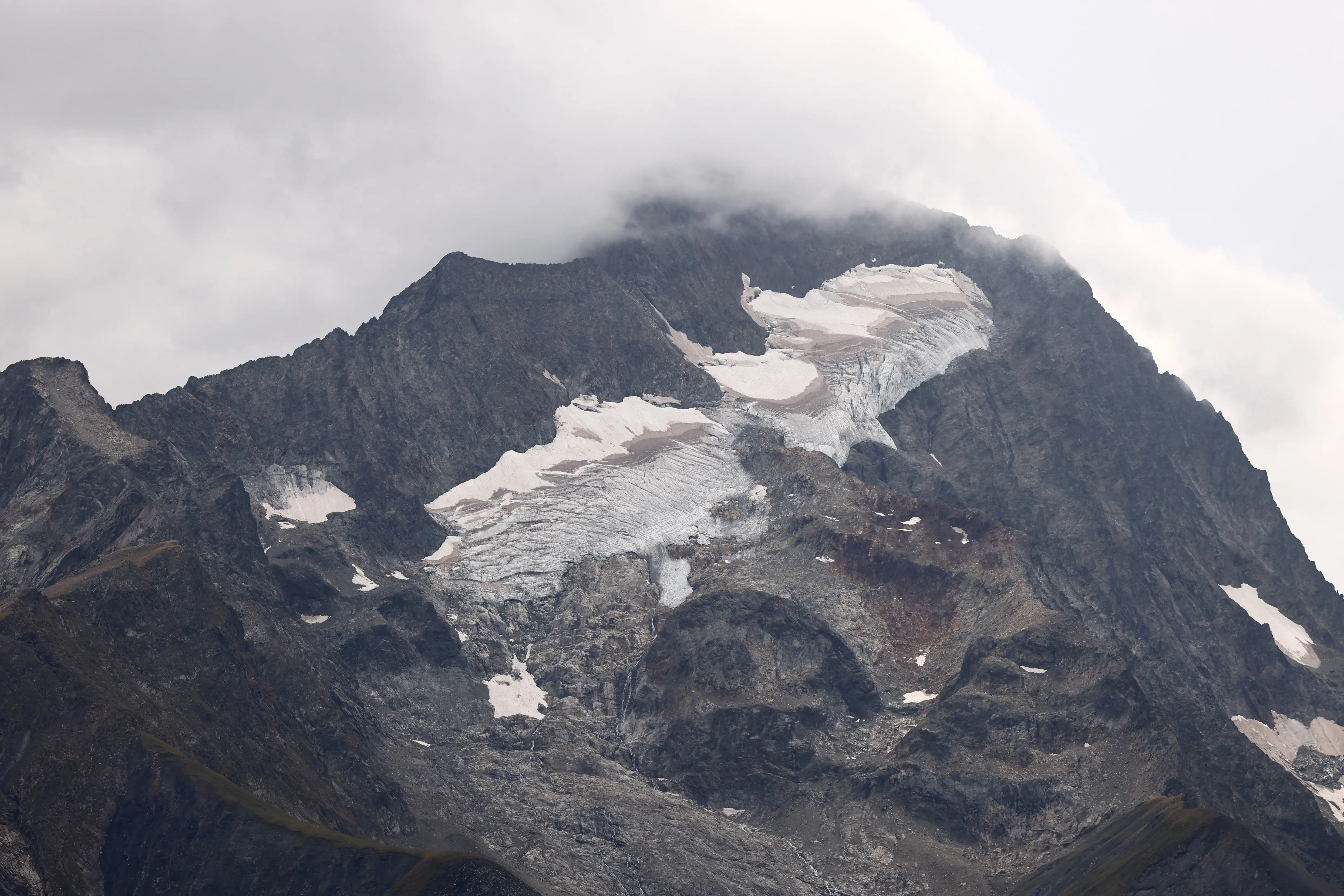 Alpine glacier was covered with sheep wool sheets to prevent melting. It worked