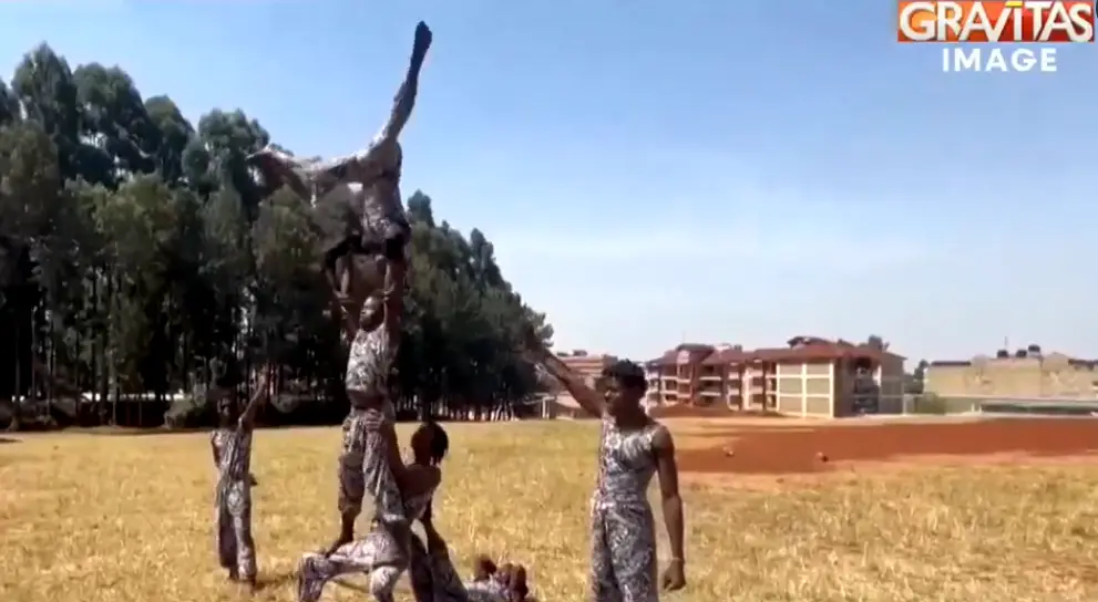 Nairobi street acrobats turn traffic signal into stage for survival