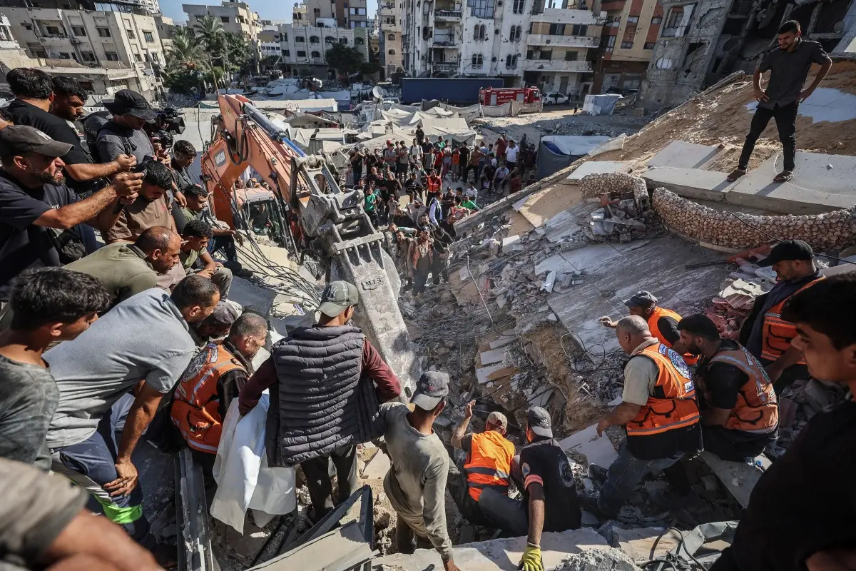 At least 20 killed after war-damaged apartment building collapses in Gaza; rescuers search for survivors
