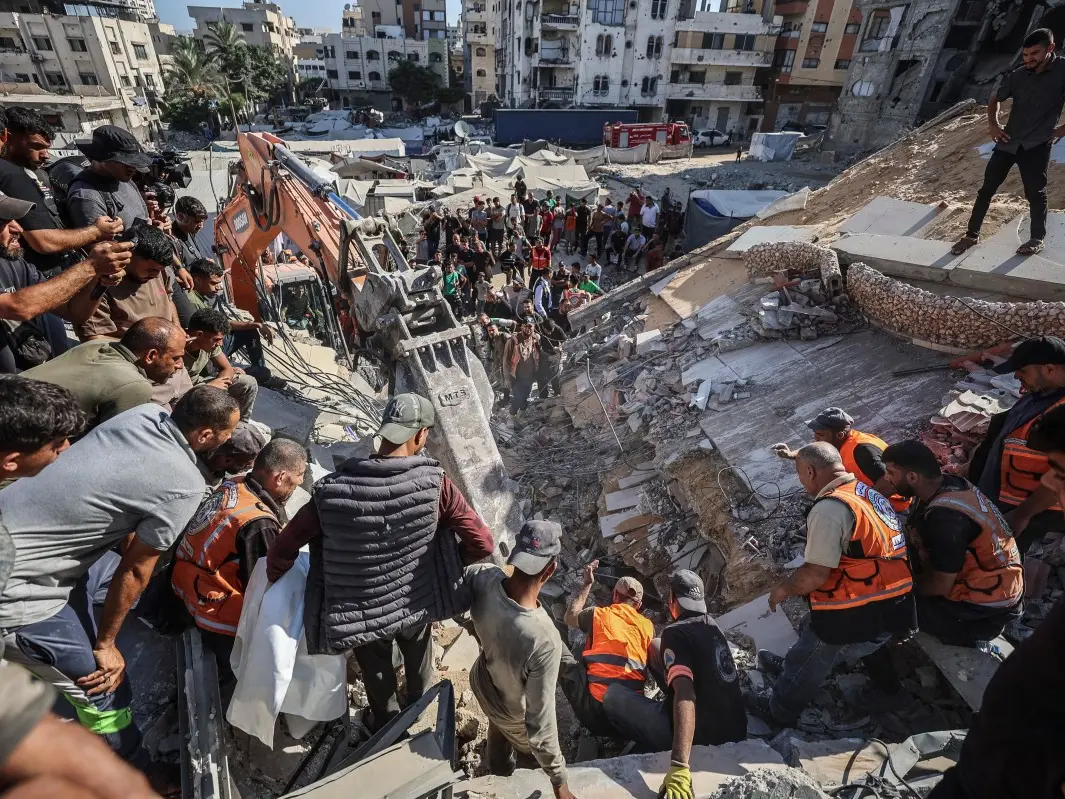 At least 20 killed after war-damaged apartment building collapses in Gaza; rescuers search for survivors At least 20 killed after war-damaged apartment building collapses in Gaza; rescuers search for survivors
