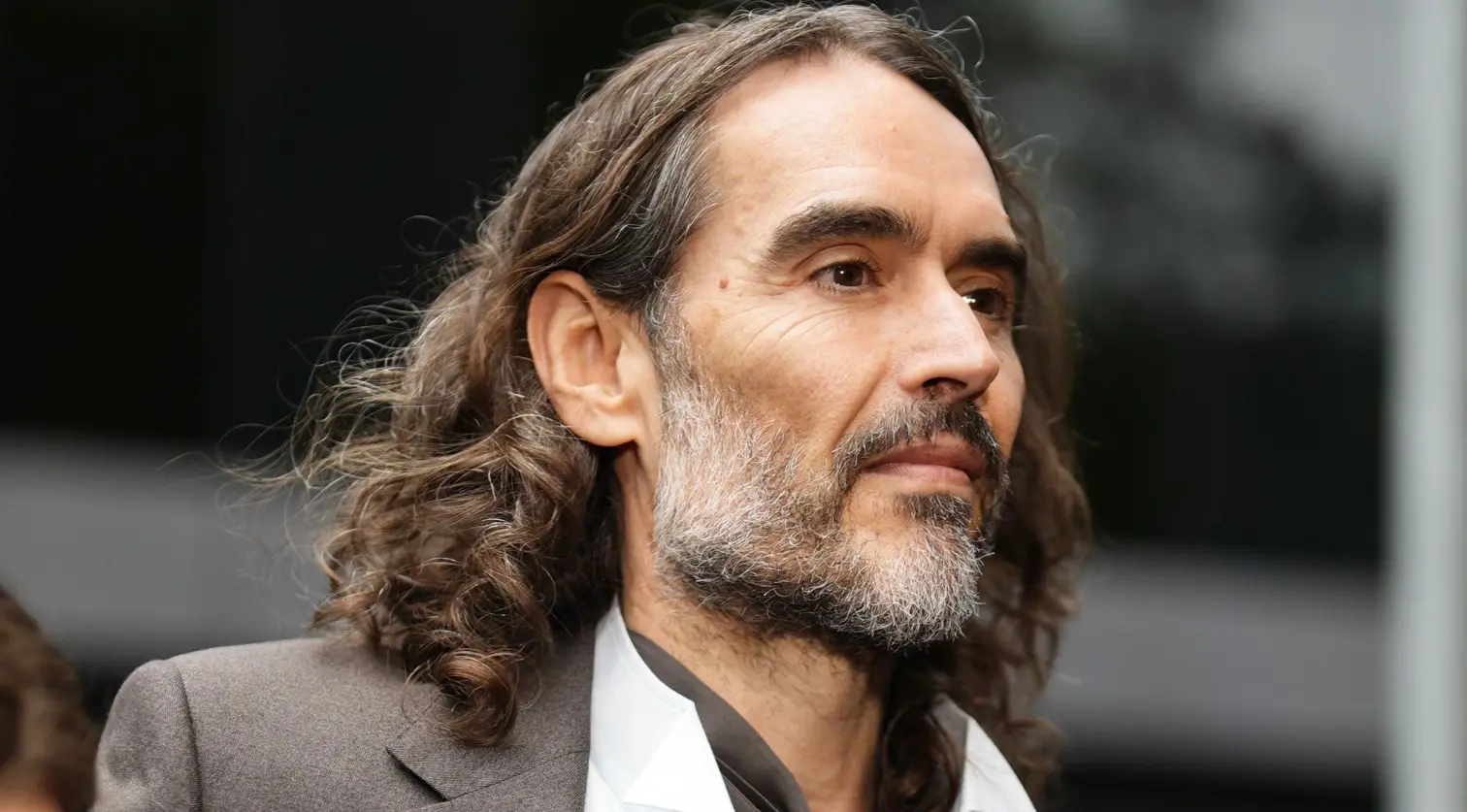 Judge drops indecent assault charge in Russell Brand trial, adds attempted assault count